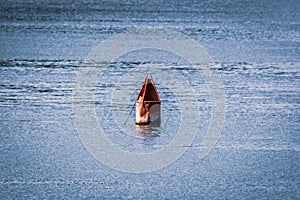 Closeup shot of a red buoy on Mississippi River, USA