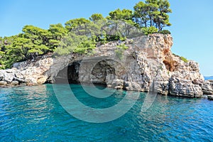 Closeup shot of rock formations in the turquoise sea at the Skiathos Island in Greece