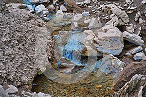 Closeup shot of the rocks on the shore of the Goldisthal pumped storage plant, Germany