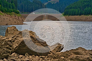 Closeup shot of the rocks on the shore of the Goldisthal pumped storage plant, Germany