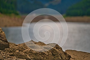 Closeup shot of the rocks on the shore of the Goldisthal pumped storage plant in Germany