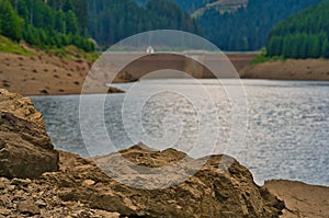 Closeup shot of the rocks on the shore of the Goldisthal pumped storage plant in Germany