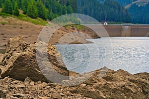 Closeup shot of the rocks on the shore of the Goldisthal pumped storage plant in Germany