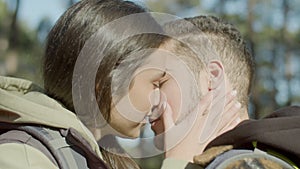 Closeup shot of romantic young couple kissing outdoors