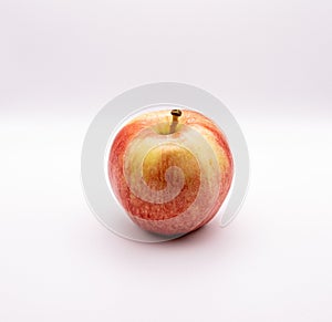 Closeup shot of a royal gala apple against a white background