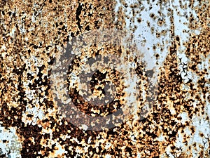 A closeup shot of a rusty metal surface. Corosion