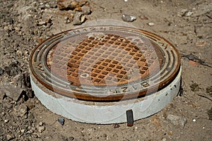 Closeup shot of a rusty sewer hatch