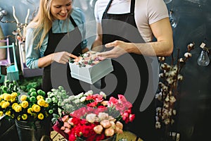 Closeup shot of salesmen showing fresh composition to customers