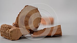 Closeup shot of sandalwood logs on a white background photo