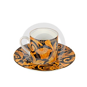 Closeup shot of a saucer and cup with orange floral designs isolated on a white background