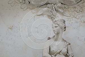 Closeup shot of a sculpture of a female with open breast in Schwetzingen, Germany