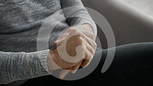 Closeup Shot Of Senior Man Applying Moisturing Cream On Hands At Home