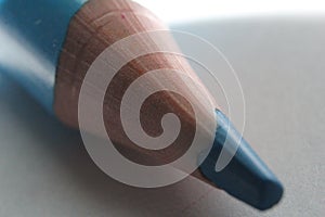 Closeup shot of a sharpened blue pencil tip