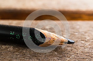 Closeup shot of a sharpened pencil on a wooden surface