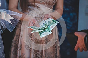 Closeup shot of a shemale with money in her hands photo
