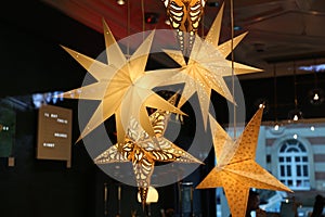 Closeup shot of shining star decorations  hanging from celing