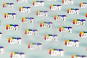 Closeup shot on Silver LOVE word with rainbow outline pattern. June as a month of gay pride and love concept.  on pastel