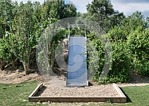 Closeup shot of a slide board in children\'s play area of Socayo park in Arroyo de la Encomienda photo