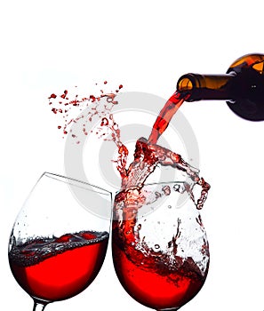Closeup shot of splashing red wine in glasses