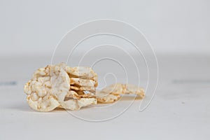Closeup shot of a stack of pignolia  on a white background