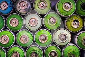 Closeup shot of stacked spray cans, paint