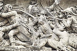 Closeup shot of the statue in the Arc de triomphe de lÃ¢â¬â¢Etoile in Prais photo