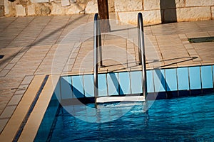 Closeup shot of a swimming pool ladd