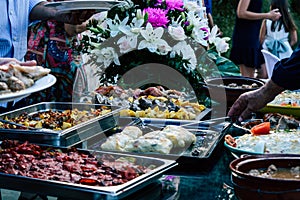 Closeup shot of a table setting with delicious meals made with meat and vegetables