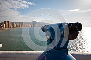 Closeup shot of a telescope on a viewpoint over the Mediterranean sea in Benidorm, Alicante