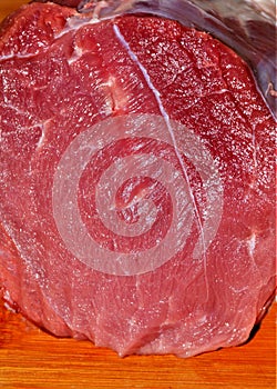 Closeup shot of the texture of a sectioned red muscle on a table