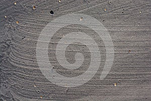 Closeup shot of a textured wall painted gray with visible brush strokes