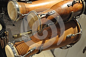 Closeup shot of three wooden dholak musical instruments photo