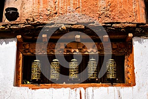 Closeup shot of the Tibetan Buddhist ritual prayer wheel at Ghar Gumba monastery in Nepal