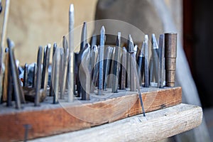 Closeup shot of tools of the silversmith for making jewelry photo