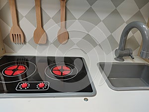 Closeup shot of toy kitchen utensils set up on a kiddy indoor playground