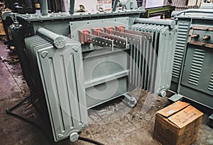 Closeup shot of transformer tank with LV bushings and radiators