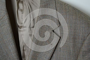Closeup shot of a tweed jacket with a rainbow pattern