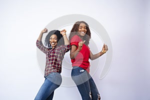 Closeup shot of two black females feeling excited and happy