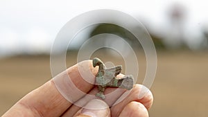 Closeup shot of Viking age bird fibula, intact, bronze
