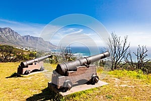 Closeup shot of vintage bomb cannons pointed at the ocean in Cape Town, South Africa