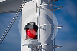 Closeup shot of warning and alerting lights on top of a boat against a clear blue sky