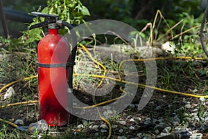 Closeup shot of a water extinguisher and firehose