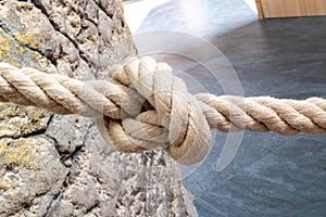 Closeup shot of a weathered knotted rope