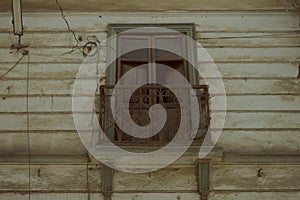 Closeup shot of a weathered rural house balcony and windows