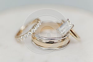 Closeup shot of wedding rings stacked on top of each other