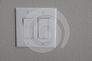 Closeup shot of a white on/off switch on the wall