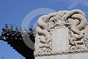 Closeup shot of white Traditional Chinese of stone tablet in Zhihua Temple, Beijing under blue sky