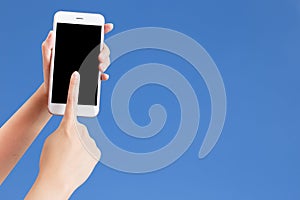 Closeup shot of a woman typing on mobile phone