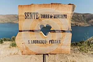 Closeup shot of wooden directional sign with writings Sente Torre de Moncorvo and S. Lorenco Felgar photo