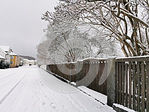 Closeup shot of a wooden fence in Larvik, Norway in winter